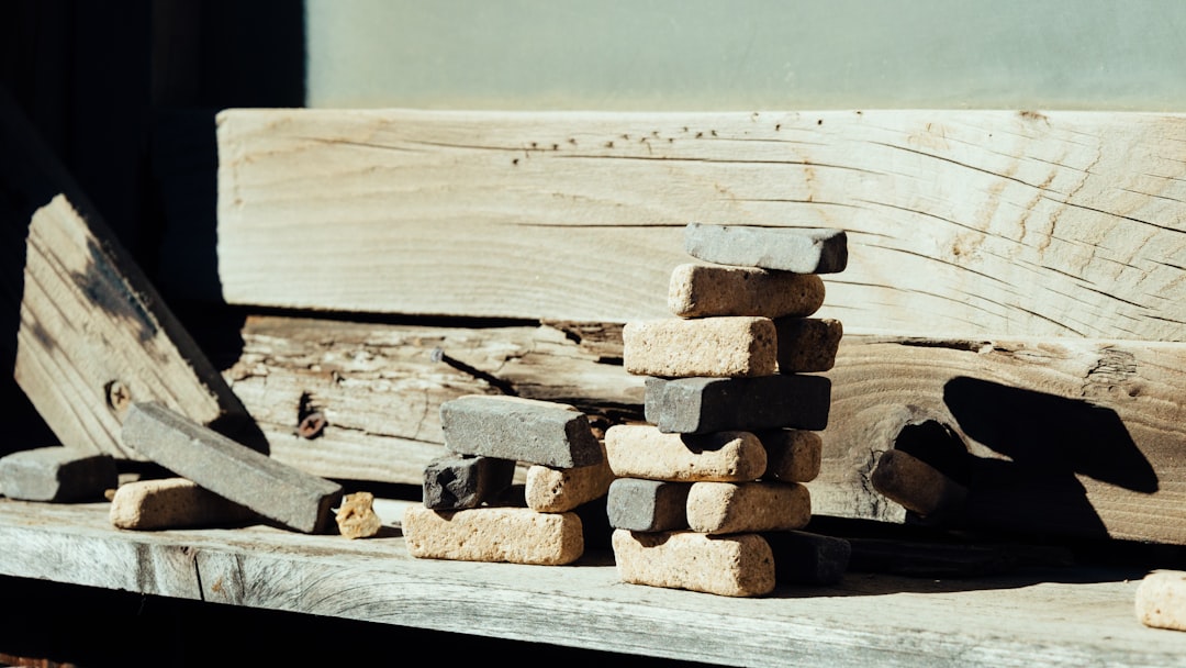 brown wooden log stack on white wooden table