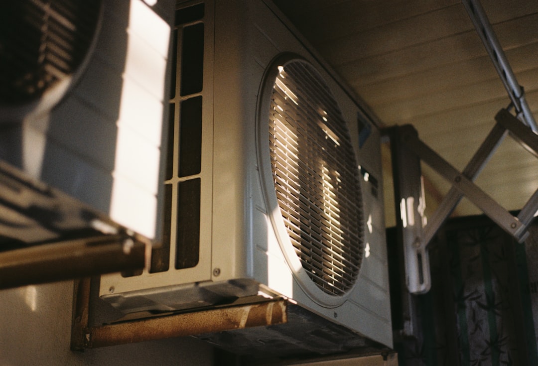 Close-up of an air conditioning unit on a sunny day.