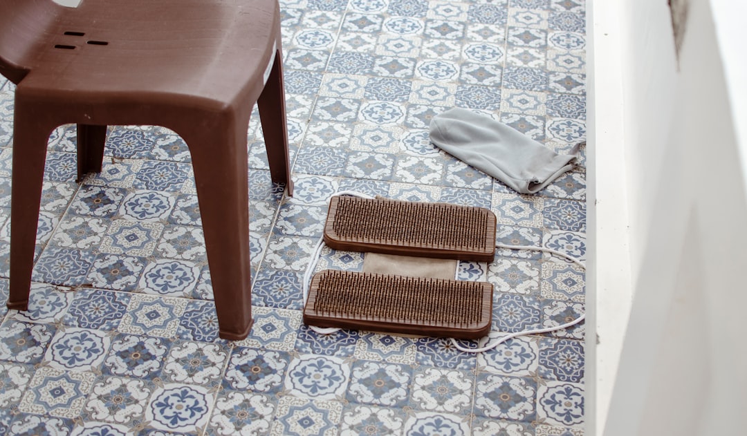 a chair and a table on a tiled floor