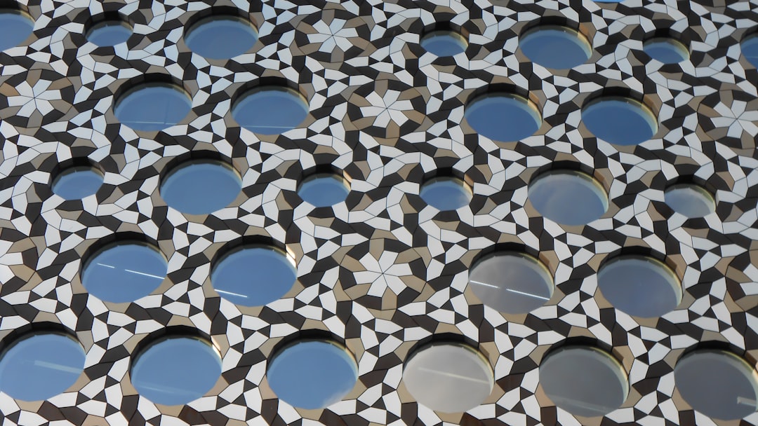 a close up of a building with many circular windows