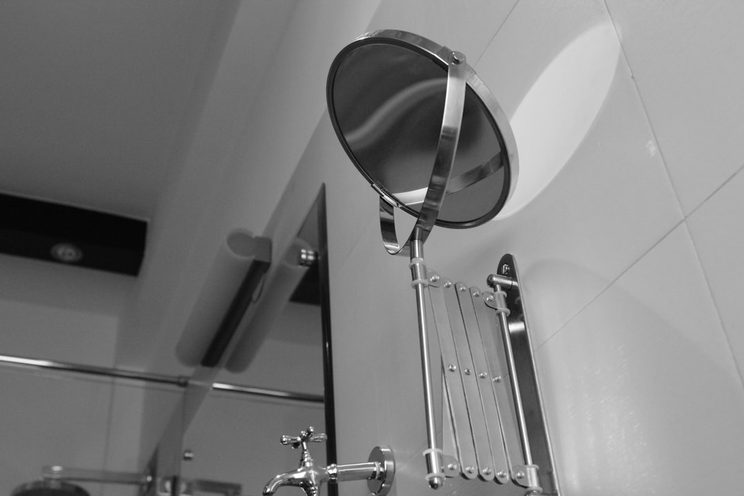 stainless steel shower head in grayscale photography