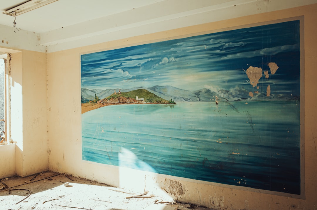 a room with a painting on the wall