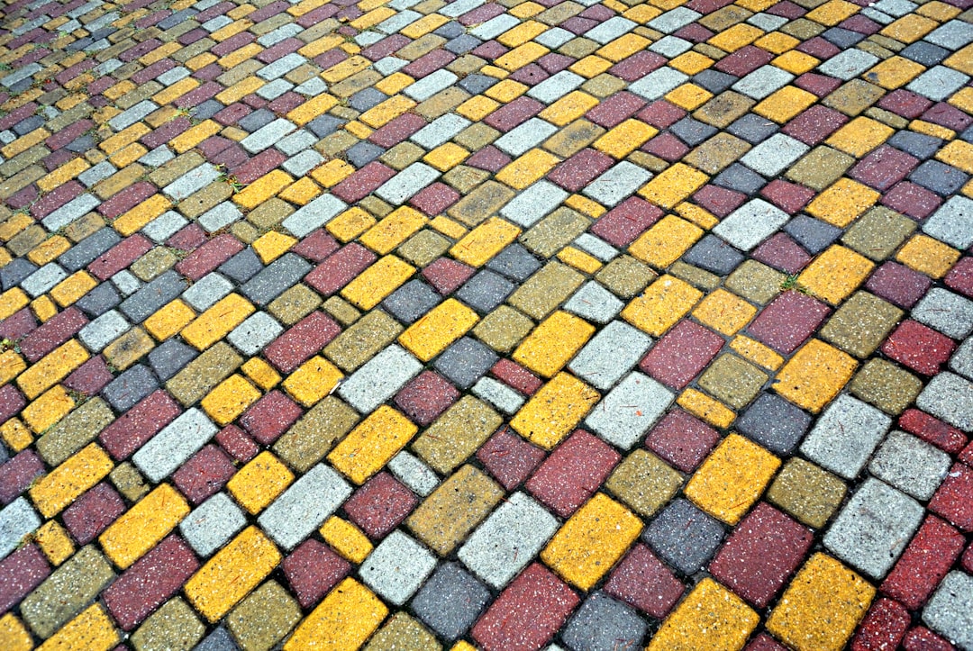 a cobblestone road with a pattern of bricks