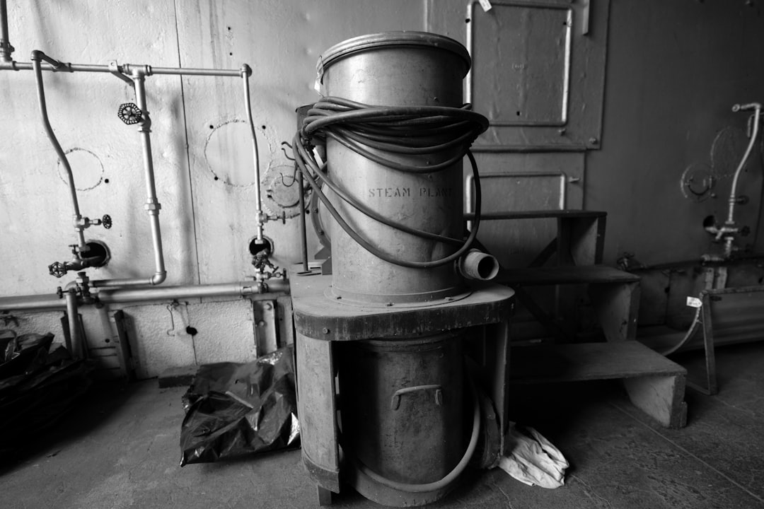 A tall cylindrical object with wires wrapped around it.