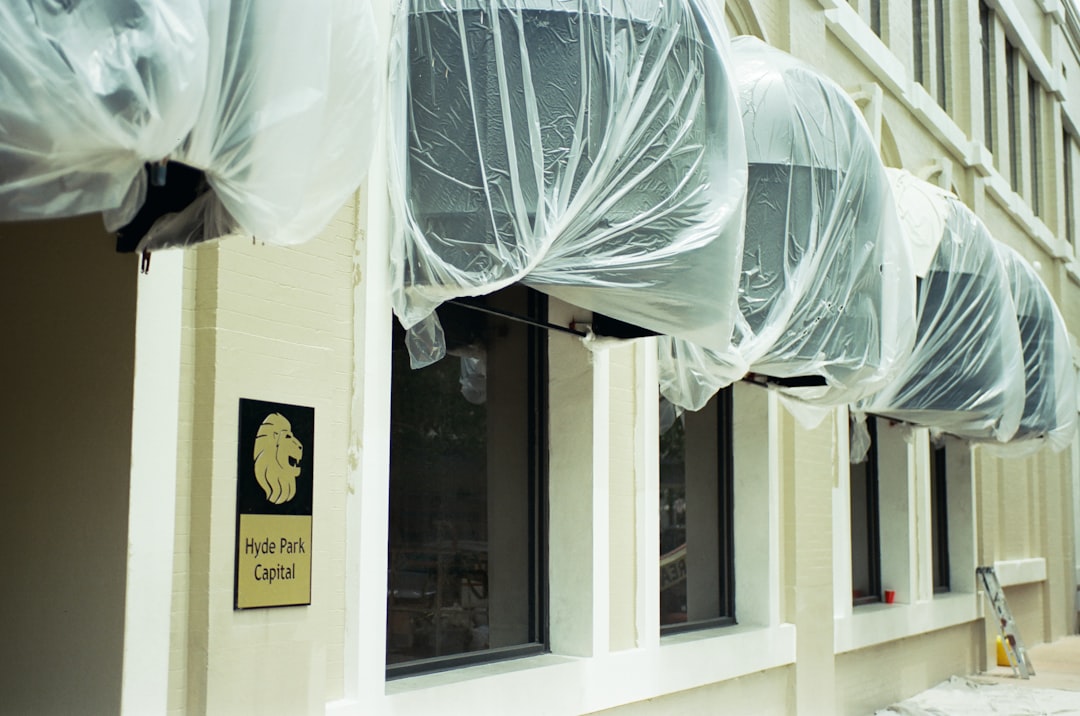 Building awnings covered in plastic sheeting