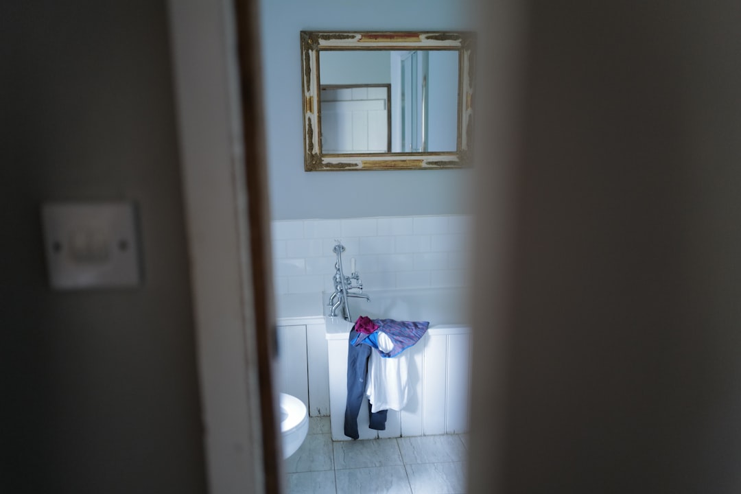 a bathroom with a mirror and a sink