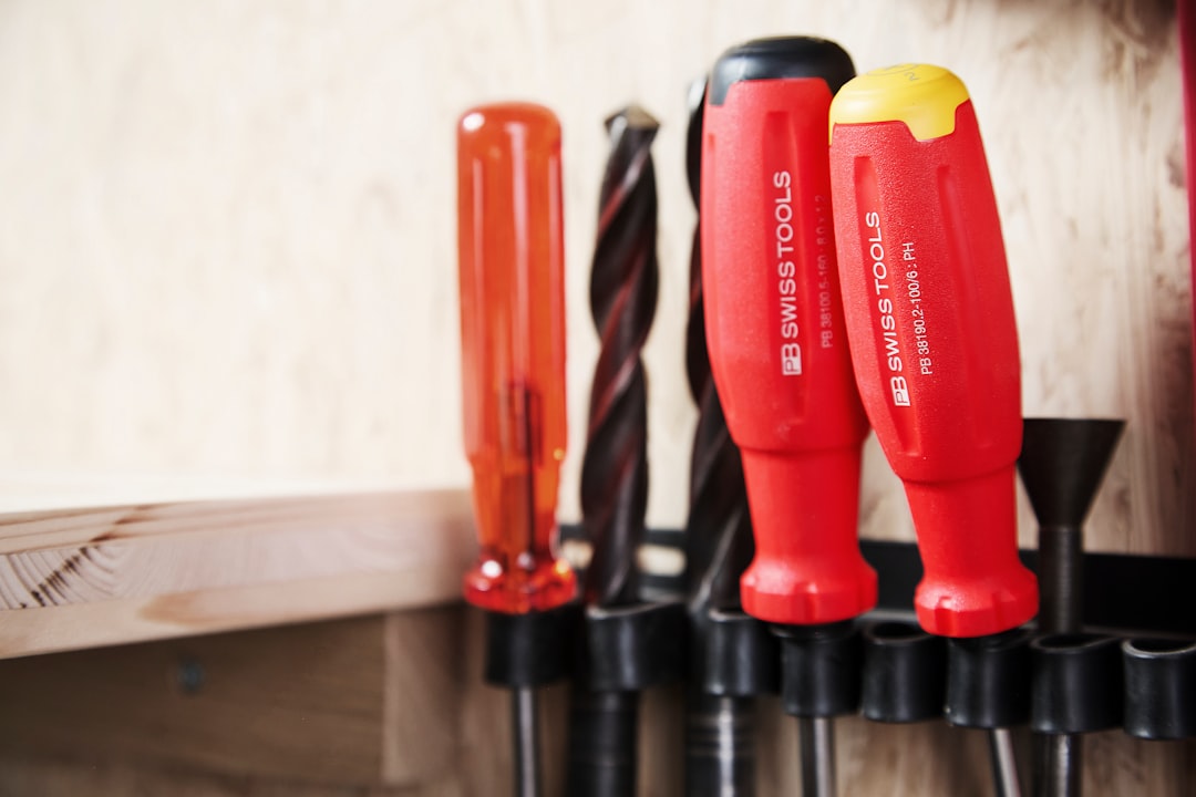 Some tools are hanging in a tool holder.