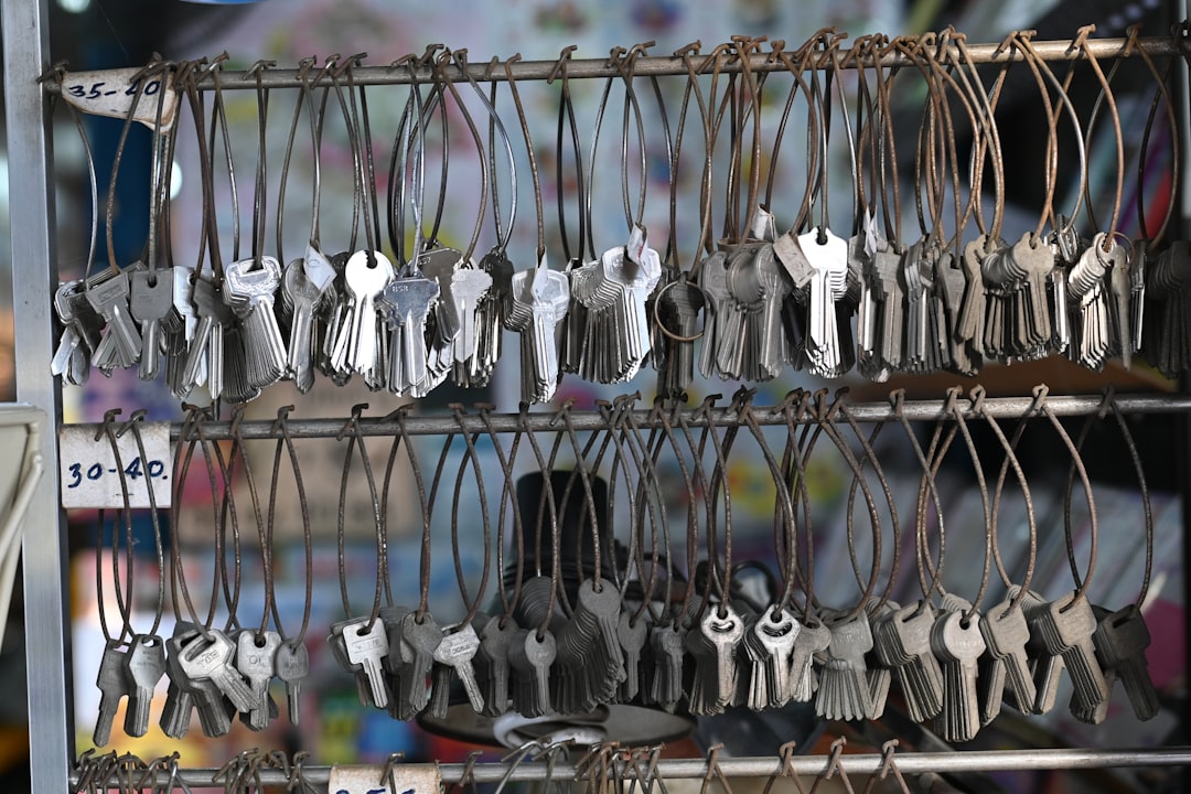 a bunch of keys are hanging on a rack